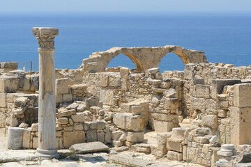 Ruins of Ancient Kourion on the background of the sea and blue sky on sunny summer day. Episkopi,...