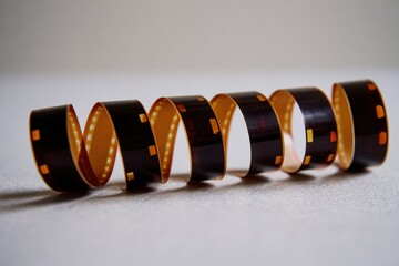 Spiraled film strip on a light surface