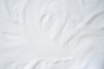 Obraz premium Colse up of various white cream foam on the table background