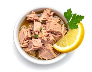 Flaked tuna in brine with lemon and parsley garnish ready for a healthy meal
