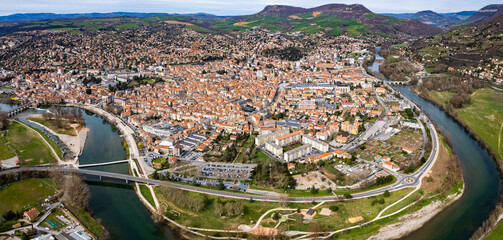 Aerial panoramic view around the old town and city Millau in France on a sunny afternoon