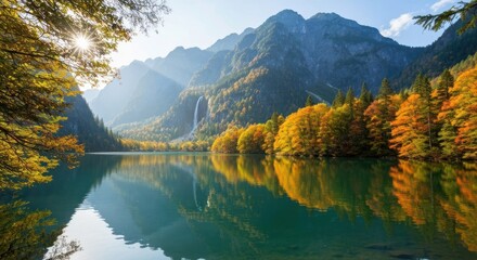Autumnal mountain lake reflecting sunlit peaks