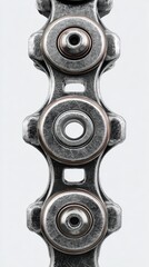 Close-up of a bicycle chain highlighting metal links and intricate design during the day