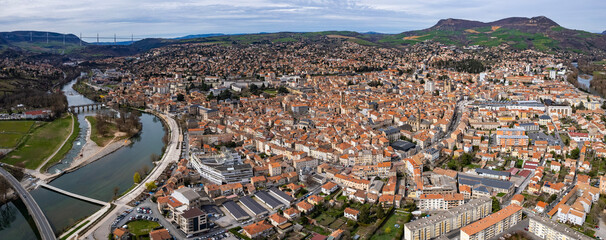 An aerial panoramic view around the old town of the city Millau in France on a sunny day in early spring