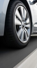 Close-up of a Silver Car Tire on Road.