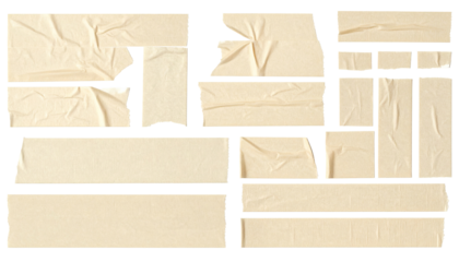 Torn beige adhesive tape pieces, various shapes and sizes
