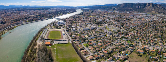 An aerial panoramic view around the old town of the city Granges in France on a sunny day in early spring