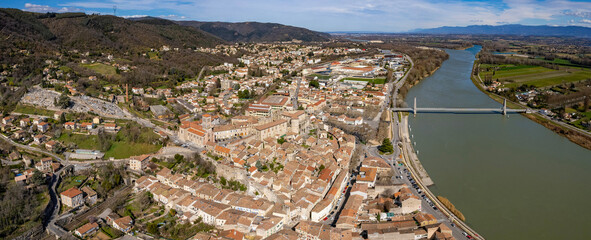 An aerial panoramic view around the old town of the city La Voulte-sur-Rhône in France on a sunny...