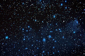 Obraz premium A deep-space photograph showcasing a myriad of stars, varying in brightness and size, scattered across a dark, inky canvas. Some areas exhibit subtle nebulosity