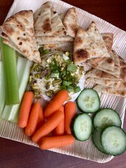 honey pistachio feta dip with naan and vegetables