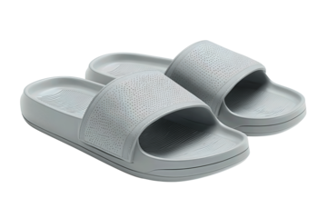 Minimalist spa slide sandals in matte dove-gray with wide perforated strap, pair overlapped toe-to-heel, isolated on transparent background.
