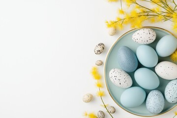 Pastel easter eggs nestled in a light blue bowl surrounded by yellow mimosa flowers on a soft background