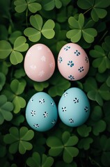Colorful easter eggs with floral patterns nestled among fresh green clover leaves for a vibrant spring celebration