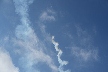 Stunt Plane and Its Corkscrew Smoke Trail