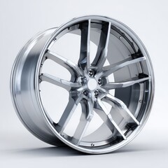 Obraz premium A sleek, silver alloy wheel with a multi-spoke design, set against a neutral grey background, showcases its polished finish and intricate detailing