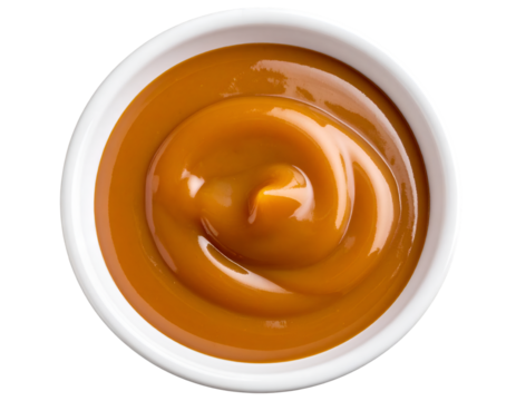 Caramel sauce in a bowl isolated on transparent background