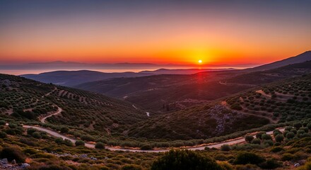 Obraz premium Sunset Over Winding Mountain Roads.