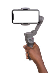 Man holding a blank smart phone on gimbal stabilizer isolated on white or transparent background