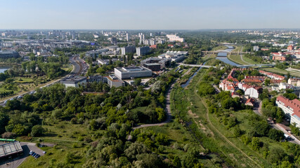 Aerial view of Poznan city with parks and modern buildings