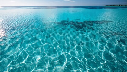Clear Turquoise Water Surface With Gentle Ripples And Reflections Creating A Serene And Tranquil Atmosphere For Relaxation And Leisure Activities