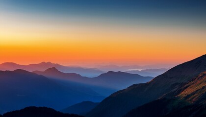 Fototapeta premium A Stunning Mountain Landscape At Sunset Featuring Layered Peaks And A Gradient Of Warm And Cool Colors In The Sky