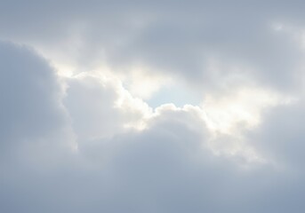 Obraz premium Sunlight peeks through a gap in the clouds, creating a bright spot in the overcast sky above the horizon