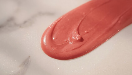 Fototapeta premium Coral Lip Gloss Swatch on Marble