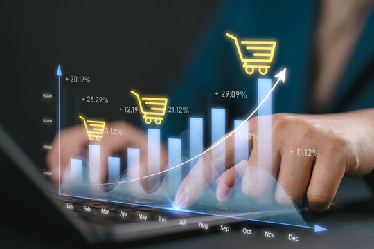 Business financial technology. Online shopping payment concept. Revenue graph increase when entrepreneur use computer to summary cost and profit shopping cart grow in total sale for online store. - Powered by Adobe