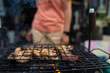 Meat pork grilled on fire outdoor camping party