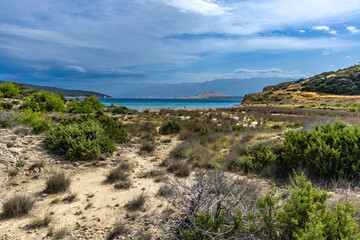A path leading through a dense forest towards Podsilo Beach on the island of Rab, sand dunes, quicksand, Mediterranean vegetation