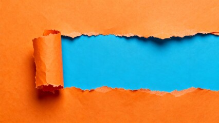 Torn orange paper revealing blue background