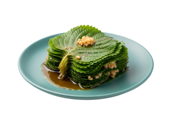 A stacked arrangement of perilla leaves, glistening with a savory sauce, presented on a teal plate against a black backdrop.
