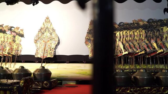 Cinematic Wide Shot of Traditional Javanese Wayang Performance Setup with Puppets and Instruments &ndash; Ultra-Realistic Ambient Lighting