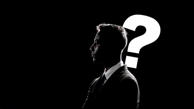 businessman with white question mark sign during thinking process. undecided about making a decision. lack of information. uncertain future. 