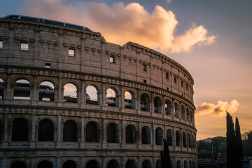 Colosseum at Sunset: An awe-inspiring image of the Colosseum, its majestic architecture dramatically illuminated by the warm hues of the setting sun.