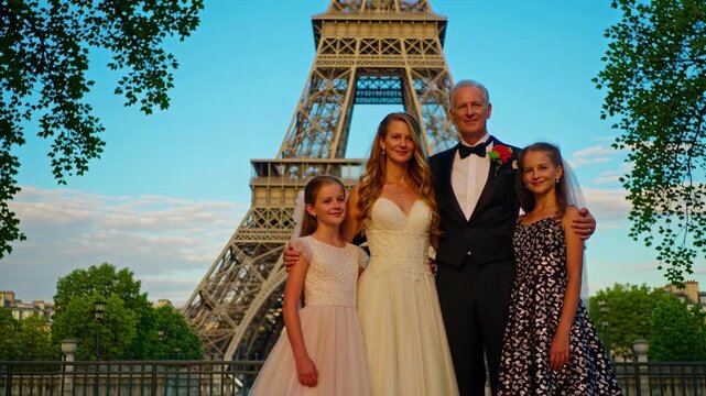 Happy family wedding portrait in front of Eiffel Tower Paris
