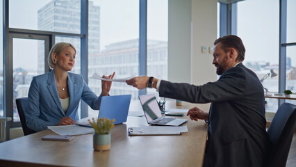 Positive lawyers exchanging papers shaking hands working at cabinet closeup