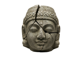 A weathered stone Buddha head, fractured by a deep fissure, exudes a sense of fragility and profound introspection against a stark black backdrop.