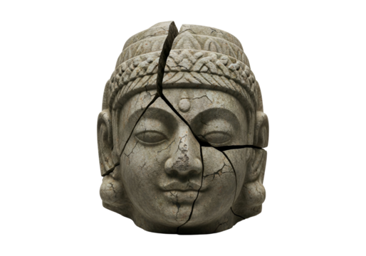 A weathered stone Buddha head, fractured by a deep fissure, exudes a sense of fragility and profound introspection against a stark black backdrop.