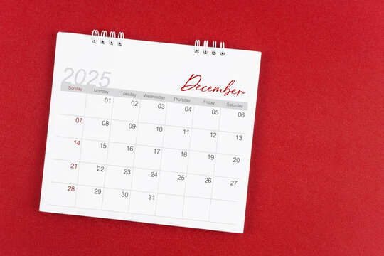 December 2025 desk calendar on red background. Page of annual monthly calendar for plan.