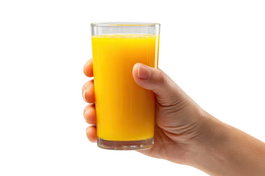 Hand holding a tall glass of orange juice