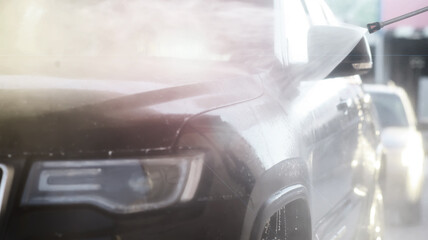 Outdoor high pressure washing for cars. Self-service express car wash.