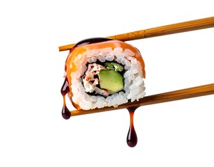 Drops of soy sauce dripping from a sushi roll sandwiched between two chopsticks on a white background