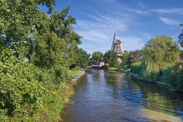 Windmill at Knockster Tief Siel,Hinte,Aurich District,East Frisia,Germany