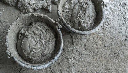 Cement mortar mixed in buckets top view, concrete sand building house site with rough grain texture well space for text © Nature Peaceful 
