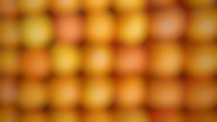 The image is a soft-focus, abstract shot dominated by a grid-like pattern of blurred, circular shapes.