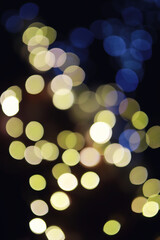 Obraz premium Abstract bokeh background. Golden bokeh circles on dark blue background. Layer overlay.