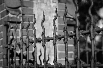 Old metal fence captured on a B&W film. Vintage style.