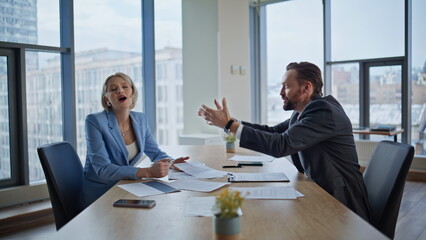 Worried entrepreneurs quarrelling loudly office. Frustrated businessman yelling