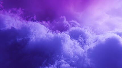 Fototapeta premium A stunning display of clouds enveloped in rich purple and blue hues captures the beauty of the evening sky. The atmosphere feels tranquil and dreamlike, perfect for contemplation.